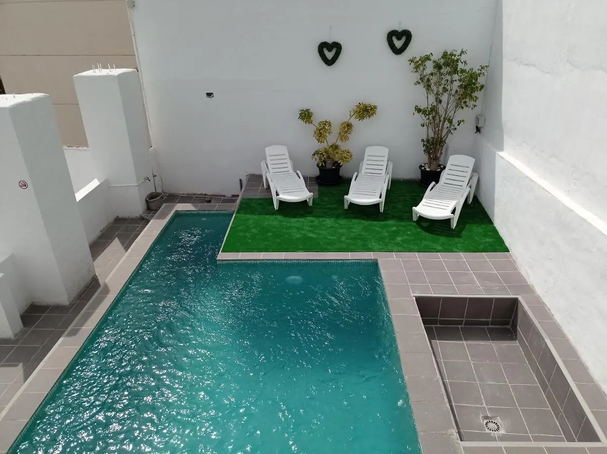 Δωμάτια σε οικογενειακή κατοικία Clark Suites Habitaciones